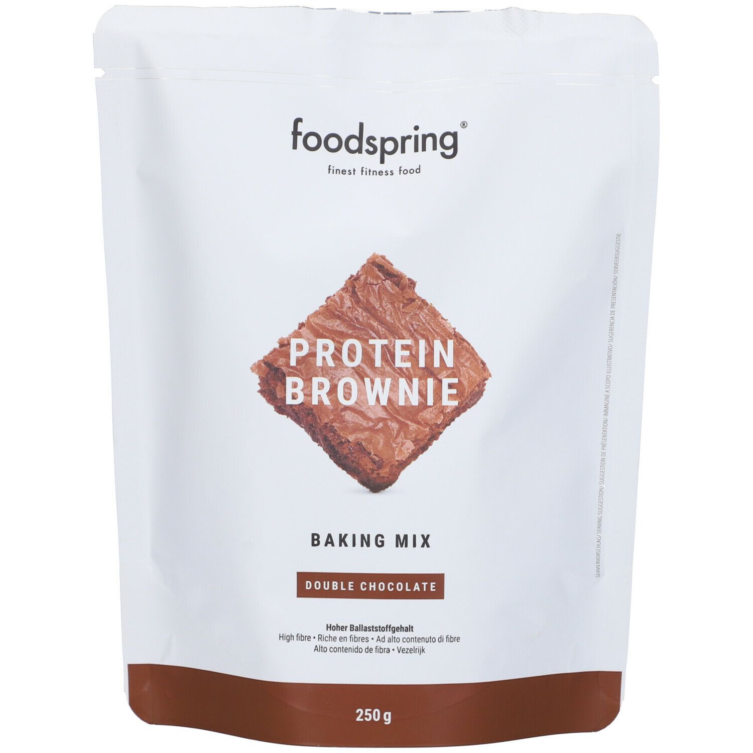 Confezione di preparato per brownie proteici Foodspring. Parte anteriore con immagine del prodotto e testo.