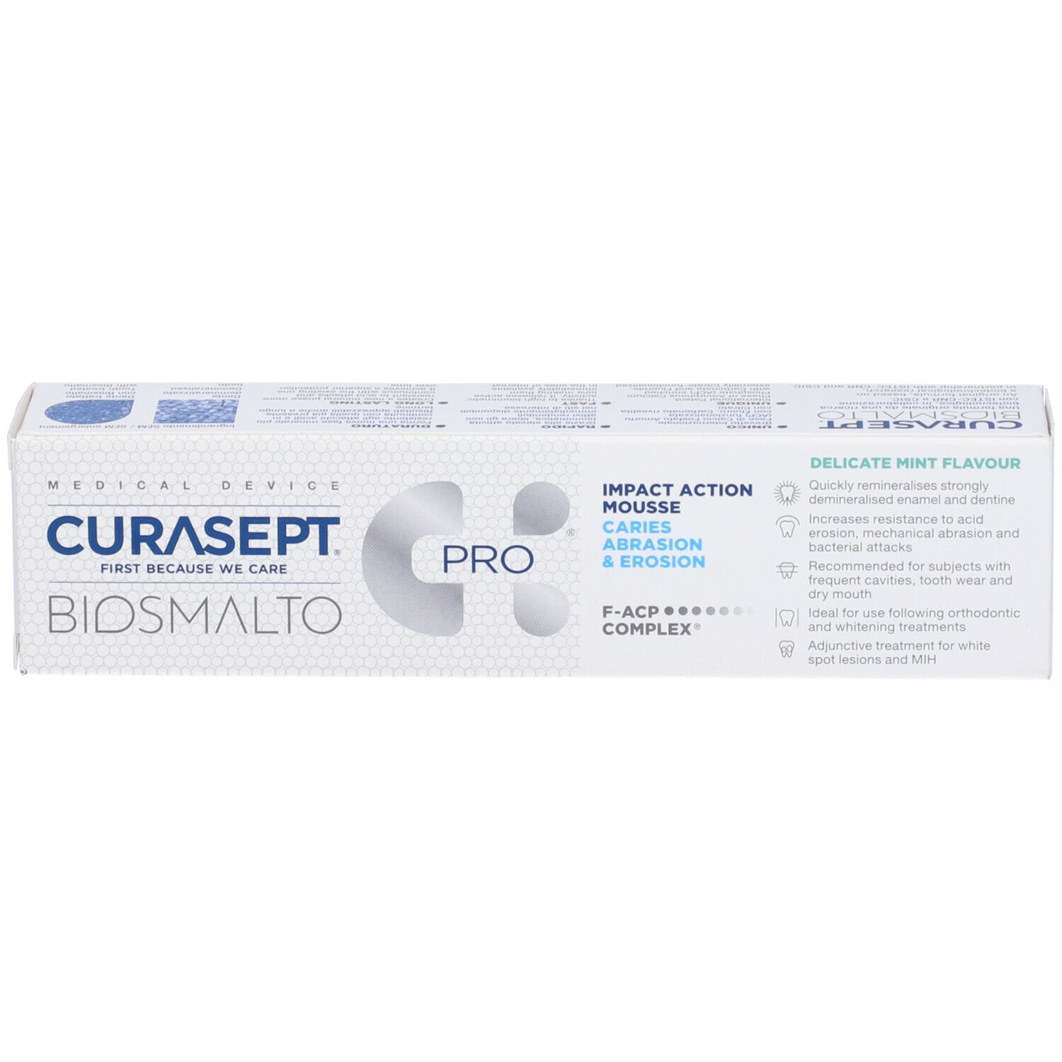 Scatola bianca con nome e logo del prodotto. Testo: Impact Action Mousse, Carie, Abrasione & Erosione. Gusto menta.