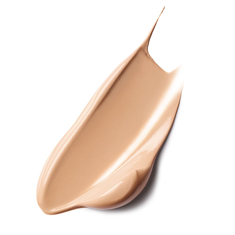 Ausgestrichene Creme. Beige Farbton. Glänzende Textur. Auf weißem Hintergrund.