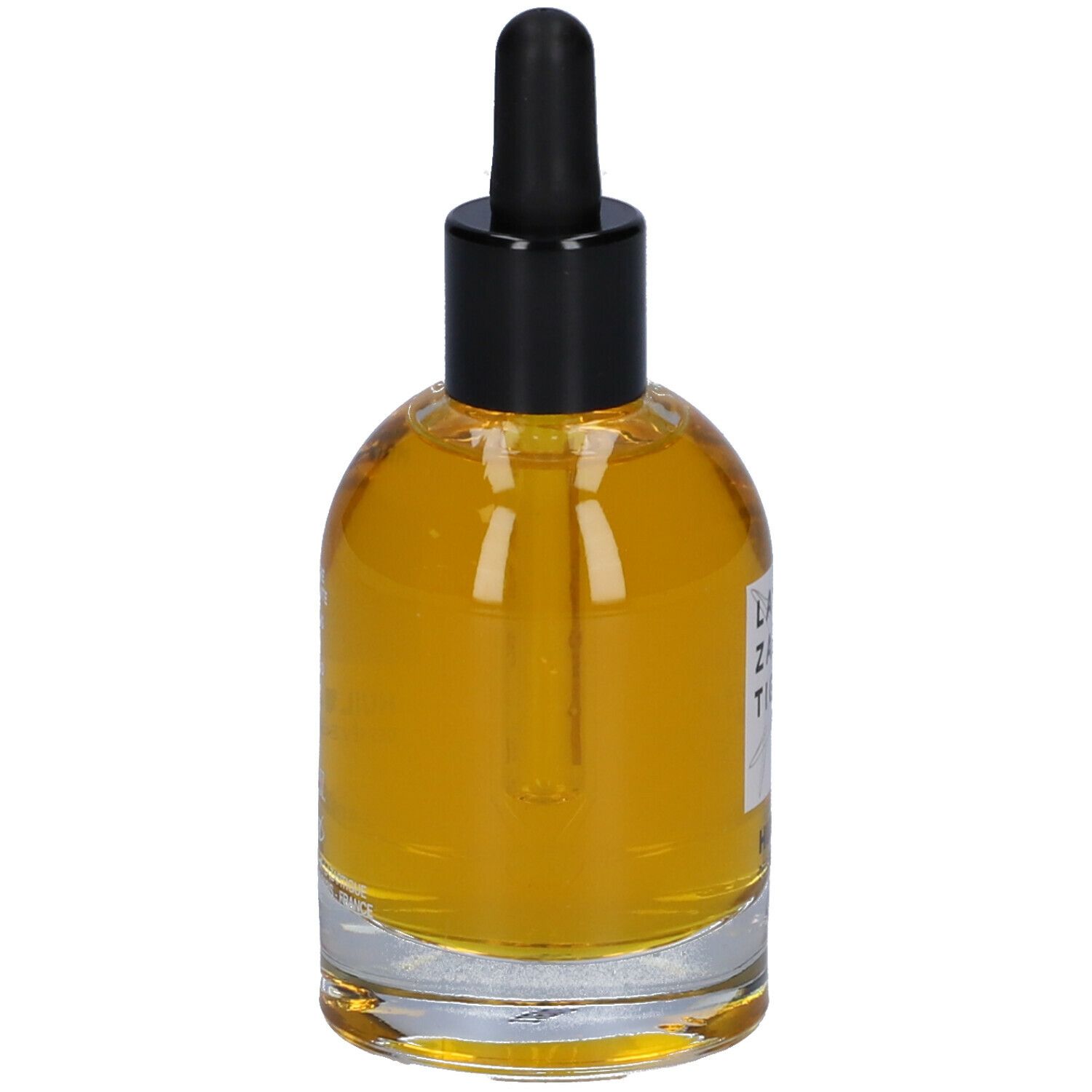 Flacone in vetro con olio. Tappo nero con contagocce. Scritta: LAZARTIGUE, HUILE DES RÊVES.