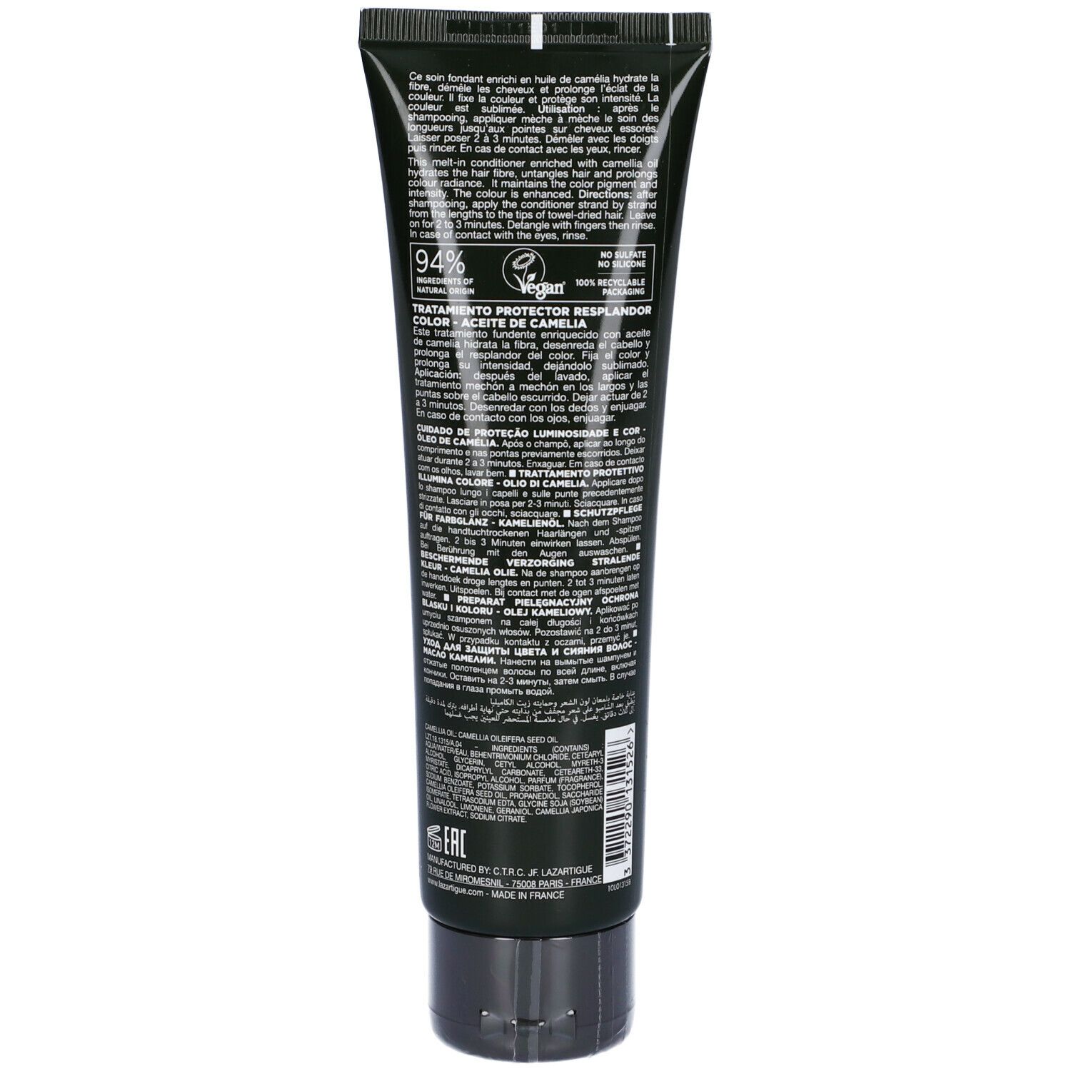 Retro di un tubo verde con tappo nero. Testo multilingue, tra cui 94% ingredienti naturali.