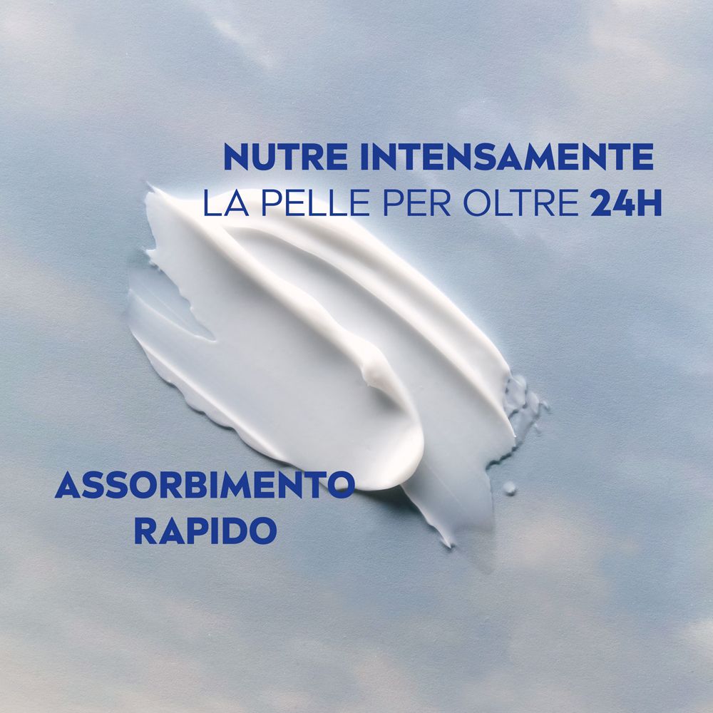 Tratti di crema. Testo: Nutre intensamente la pelle per oltre 24h. Assorbimento rapido.