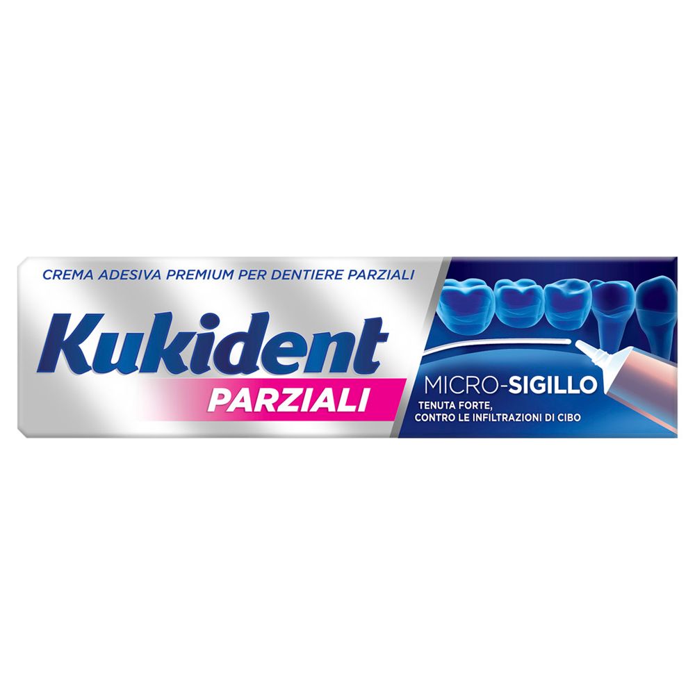 Tubo di crema adesiva per dentiere parziali. Marchio e testo in italiano. Colori bianco e blu.