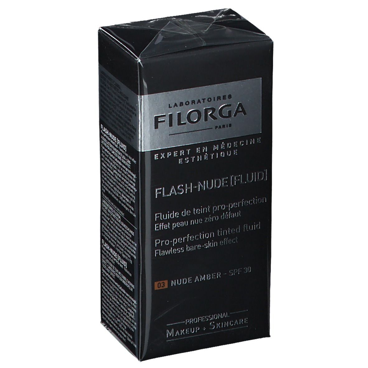 Schwarzer Karton mit FILORGA Make-up. Aufschrift: FLASH-NUDE [FLUID], NUDE AMBER, SPF 30. Verpackung.