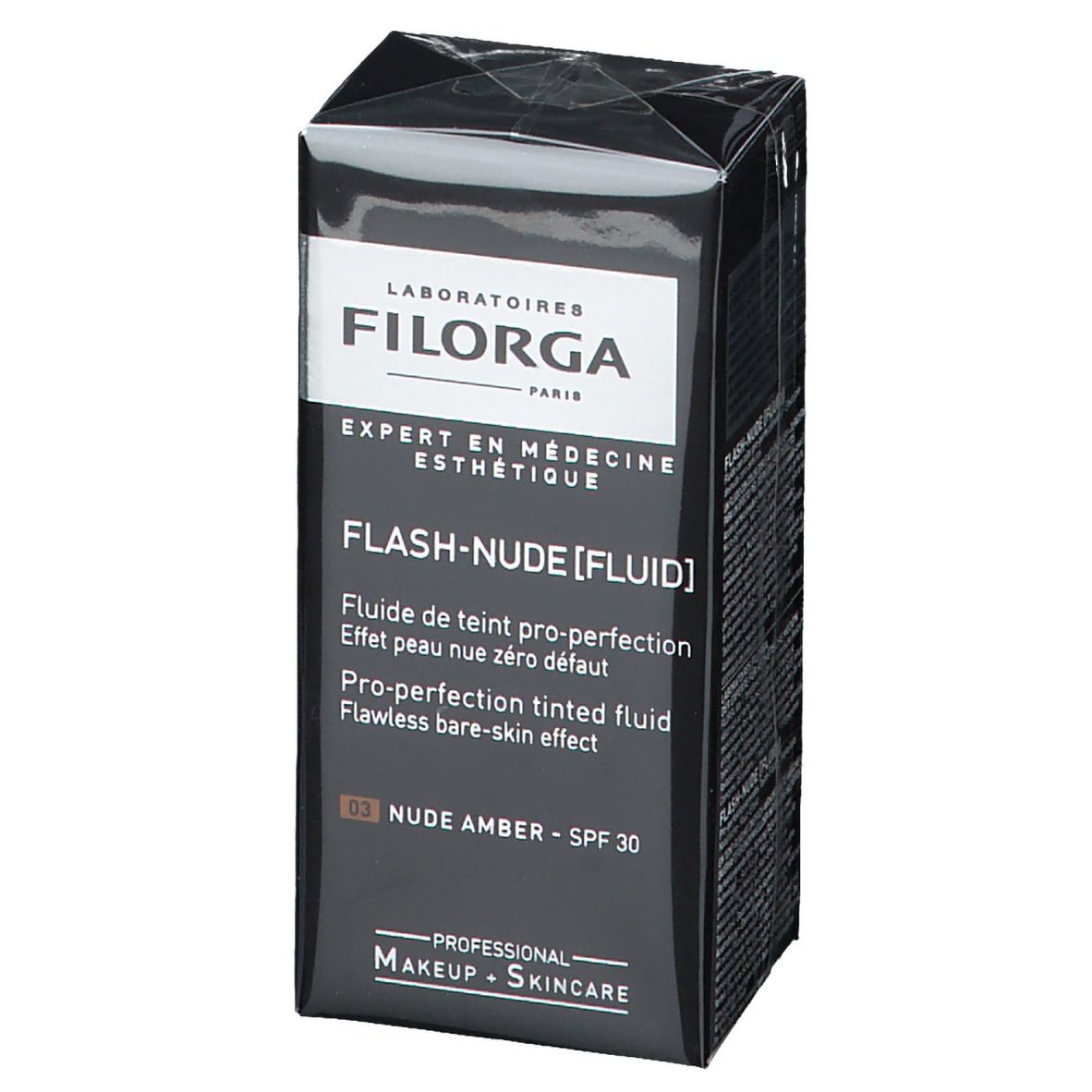 Schwarzer Karton mit FILORGA Make-up. Aufschrift: FLASH-NUDE [FLUID], NUDE AMBER, SPF 30. Verpackung.