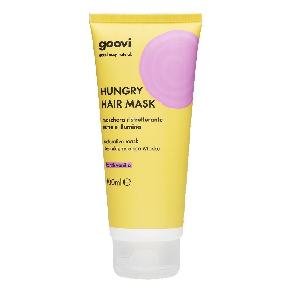 Tubo giallo "Goovi Hungry Hair Mask". Cerchio rosa. Testo in tedesco, italiano, inglese. "100ml" visibile.