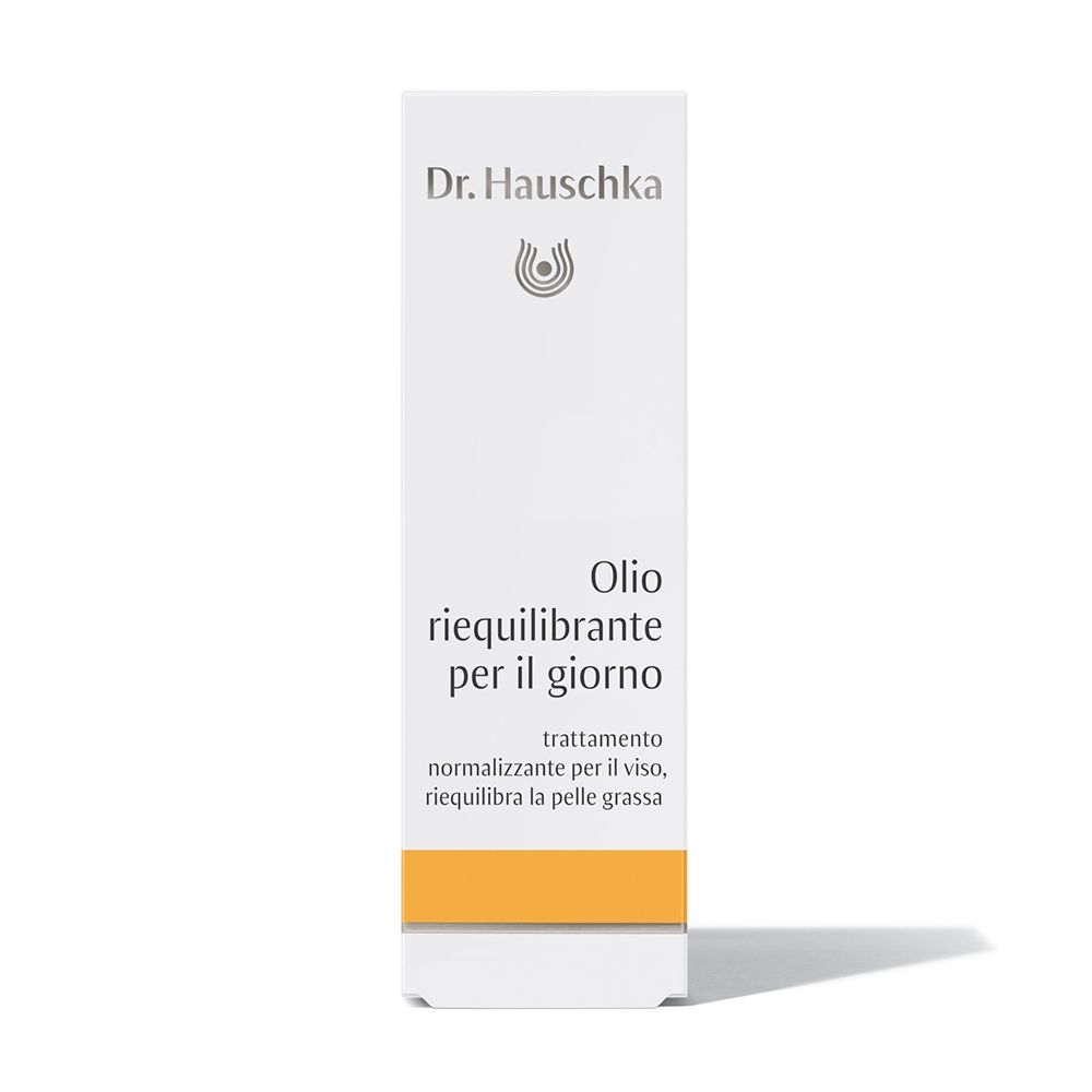 Weiße Verpackung mit Dr. Hauschka-Logo und Produktbezeichnung. Orangefarbener Streifen am unteren Rand.