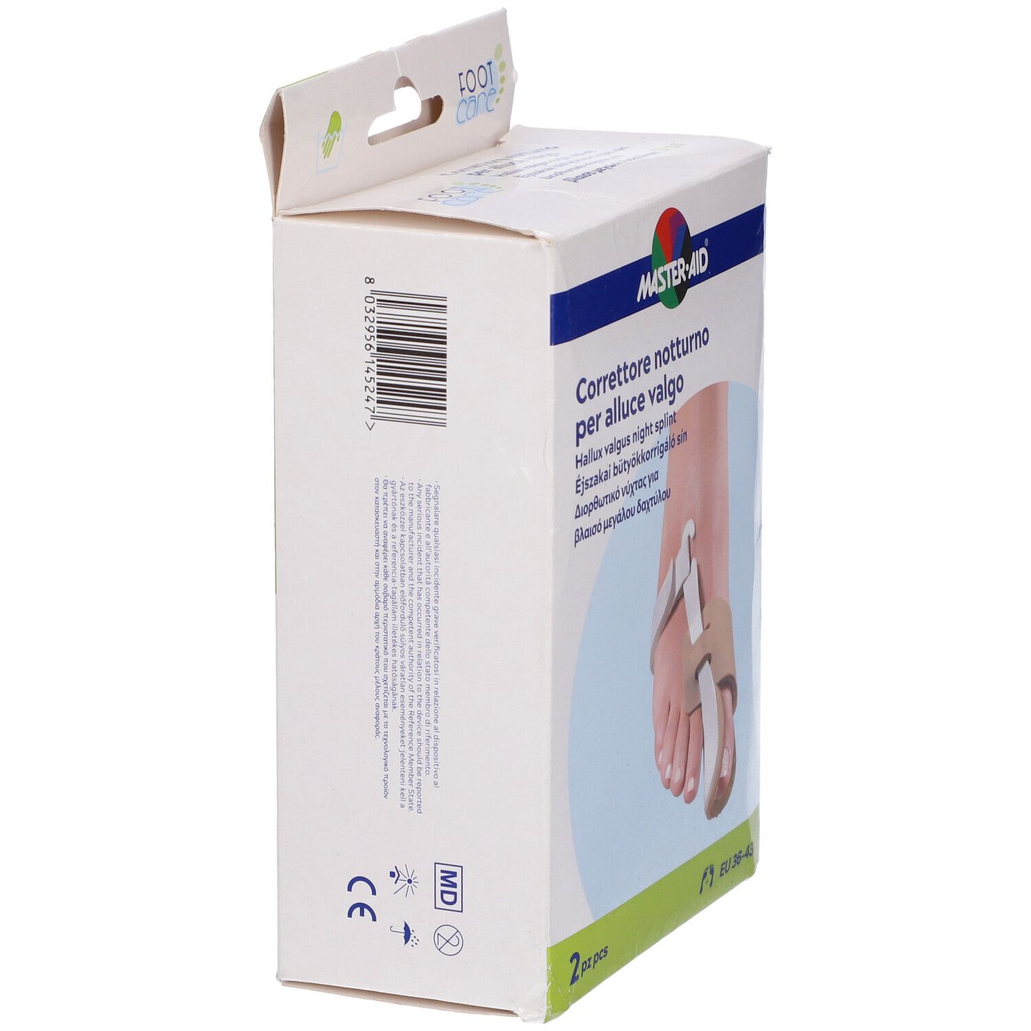 Confezione del prodotto, vista laterale. Testo e immagine di un piede con tutore per alluce valgo. Marca: Master-Aid Footcare. Taglia: EU 36-43. 2 pezzi.