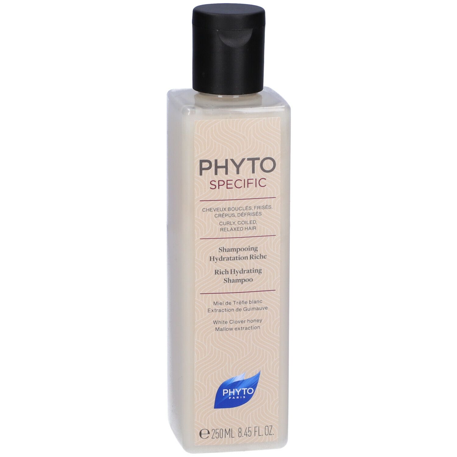 Flacone di shampoo beige con tappo nero. Forma quadrata. Scritta: PHYTOSPECIFIC, Rich Hydrating Shampoo.