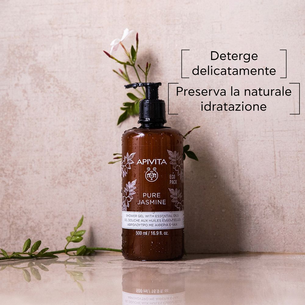 Flacone marrone con dosatore nero. APIVITA Pure Jasmine. Decorato con fiori e rami di gelsomino.