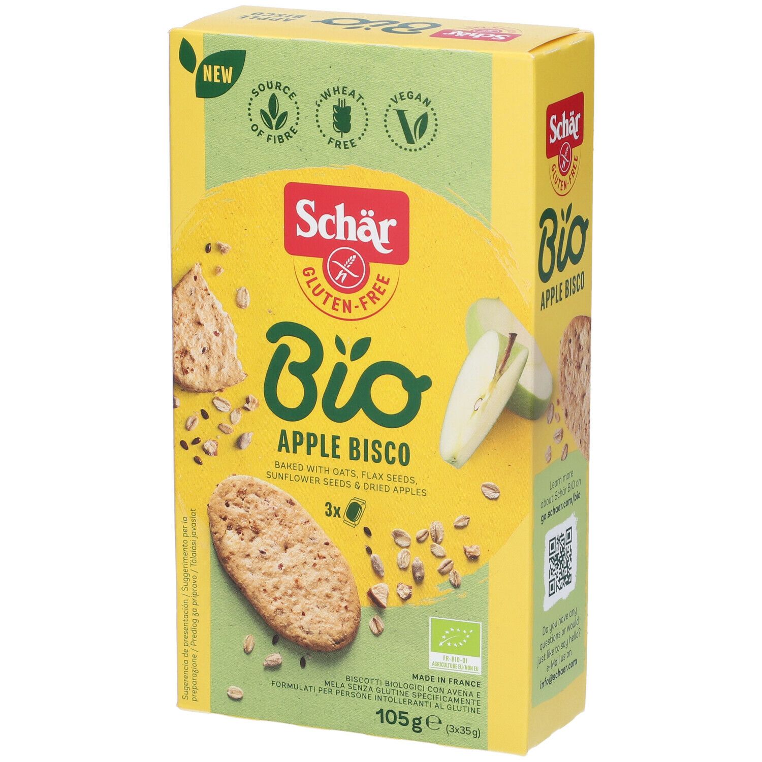 Scatola gialla "Schär Bio Apple Bisco". Senza glutine, vegano. Biscotti, pezzi di mela e semi illustrati. 105g.