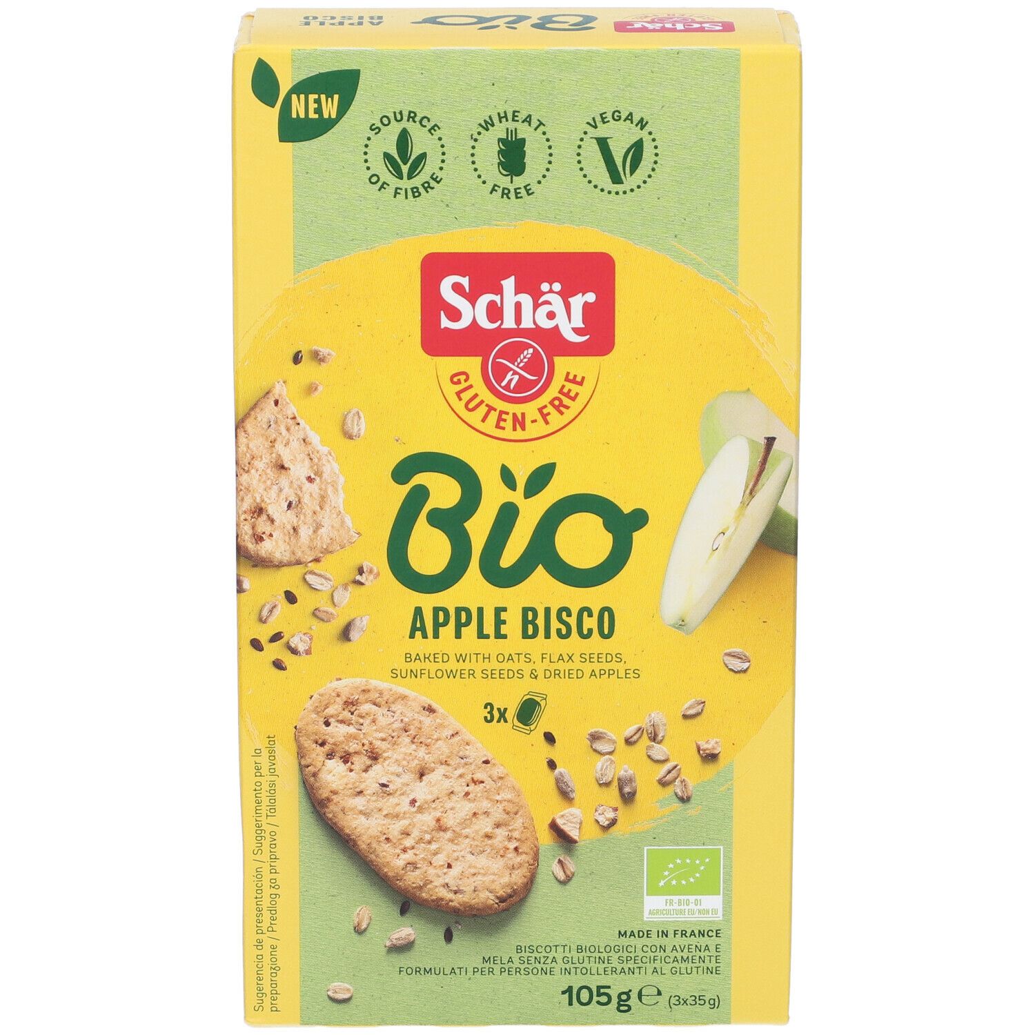 Scatola gialla "Schär Bio Apple Bisco". Senza glutine, vegano. Biscotti, pezzi di mela e semi illustrati. 105g.