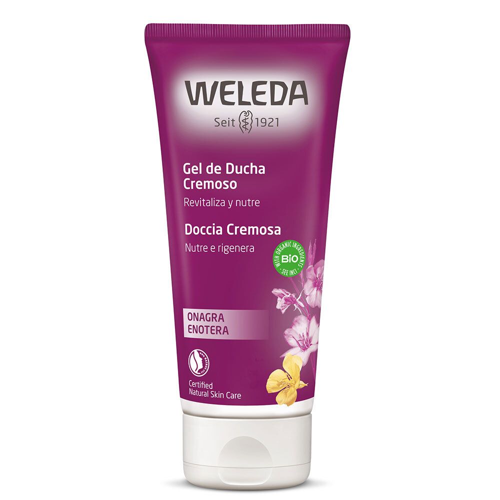 Tubo di gel doccia Weleda, viola. Scritta: Weleda, Gel de Ducha Cremoso, Doccia Cremosa. Sigillo bio. Onagra/Enotera.
