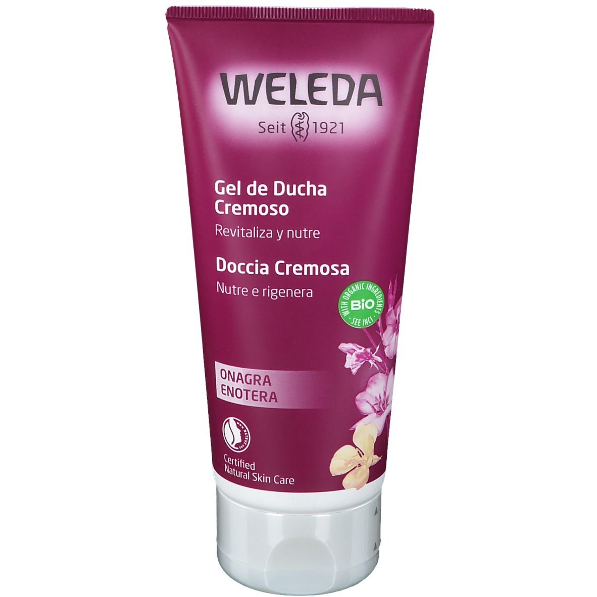 Tubo di gel doccia Weleda, viola. Scritta: Weleda, Gel de Ducha Cremoso, Doccia Cremosa. Sigillo bio. Onagra/Enotera.
