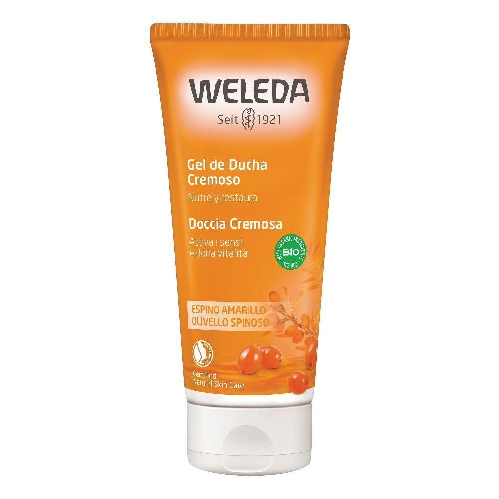 Tube orange avec bouchon blanc. Inscription: WELEDA, Gel de Ducha Cremoso, label bio. Illustration d'argousier.