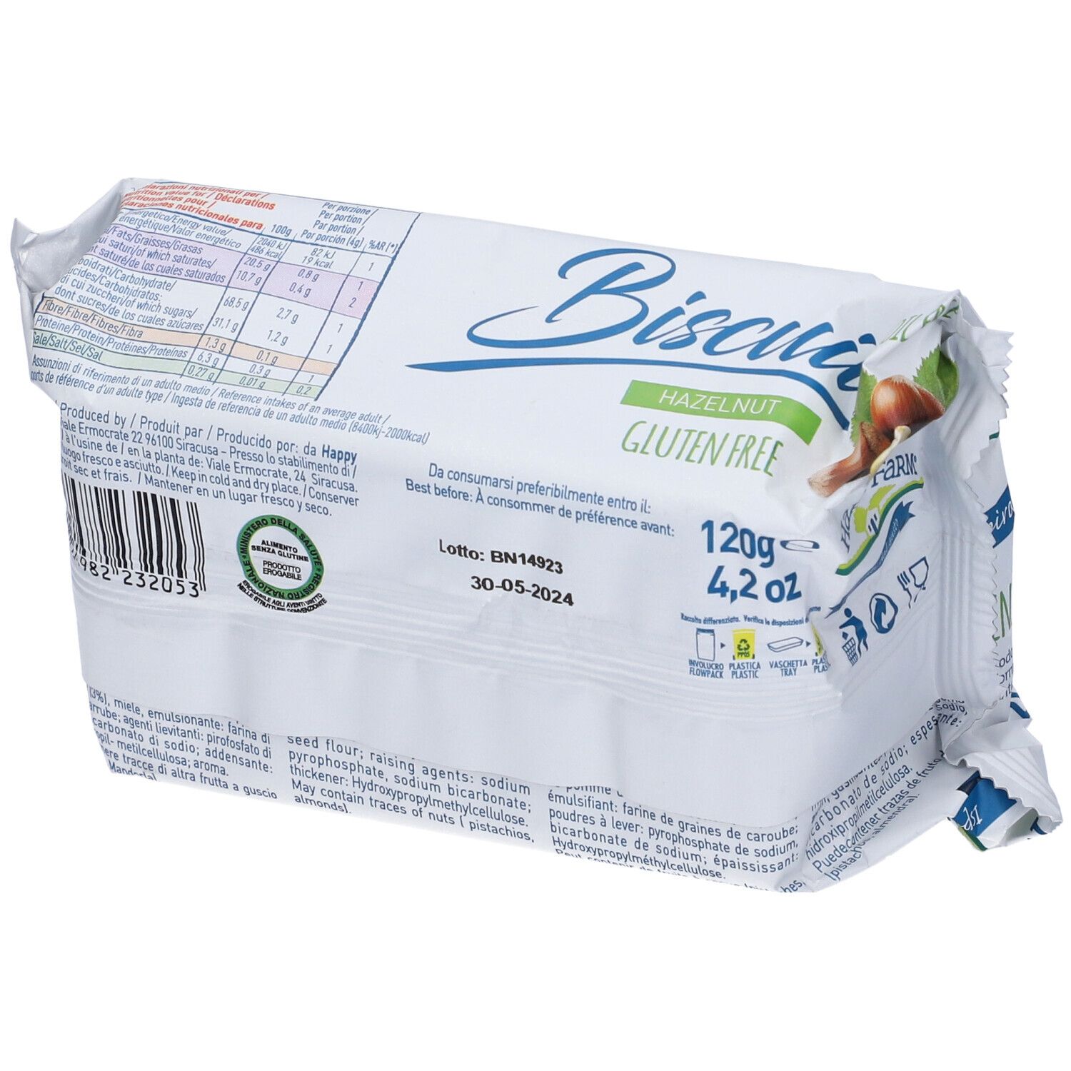 Confezione di biscotti Happy Farm alla Nocciola. Senza glutine. Retro con informazioni nutrizionali e scadenza.
