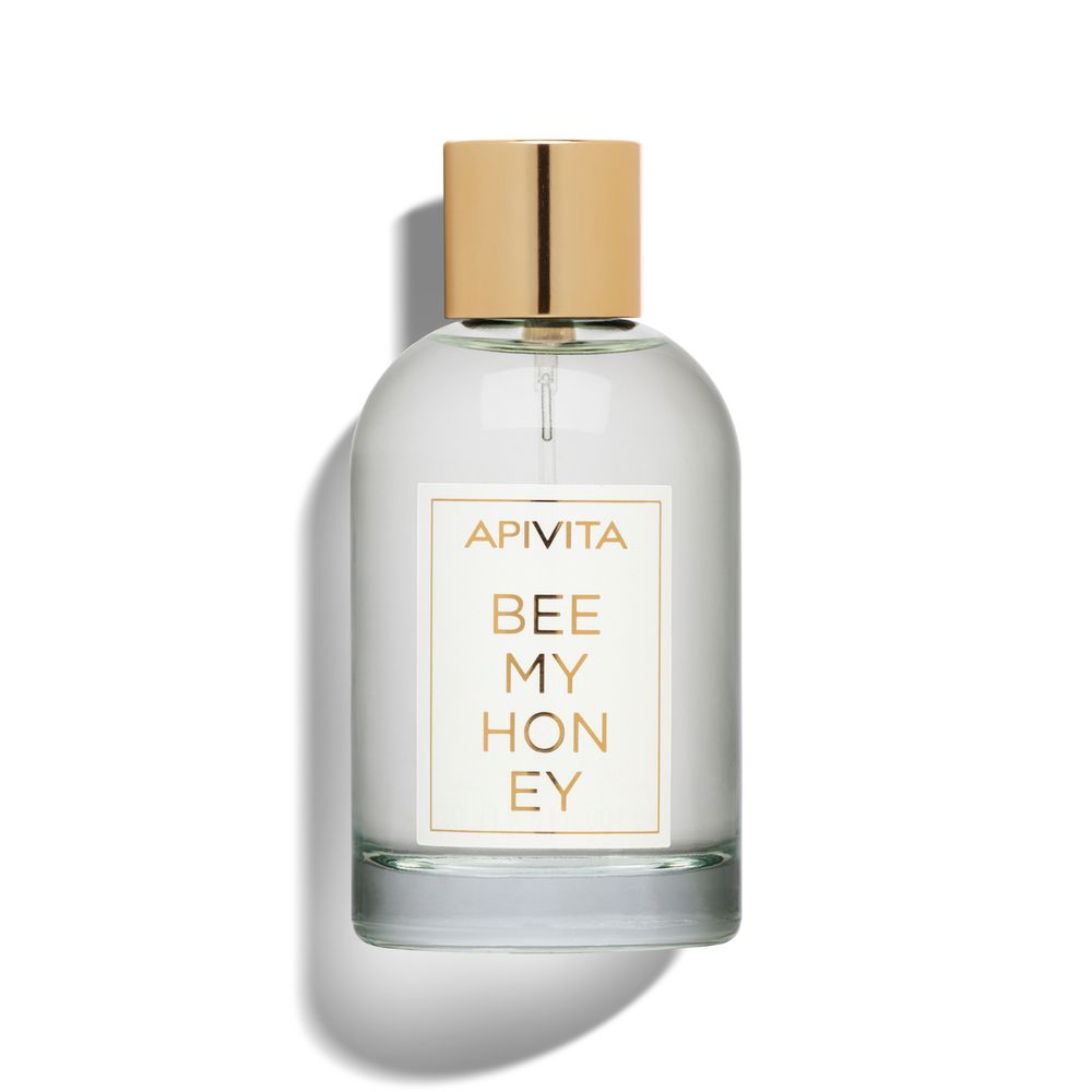 APIVITA Bee My Honey Eau de Toilette. Flacone trasparente, tappo dorato. Etichetta bianca con nome del prodotto.
