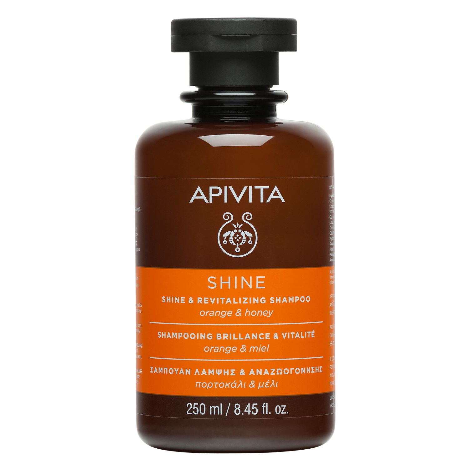 Flacone di shampoo marrone con tappo nero. Scritta: APIVITA SHINE Shampoo, Arancia e miele. 250 ml.