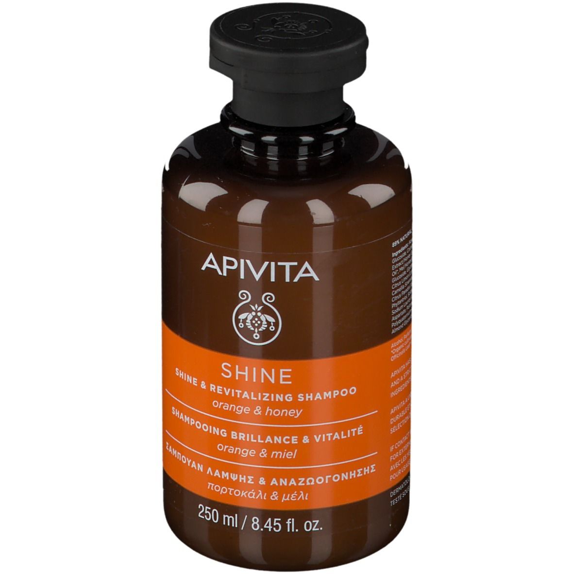 Flacone di shampoo marrone con tappo nero. Scritta: APIVITA SHINE Shampoo, Arancia e miele. 250 ml.