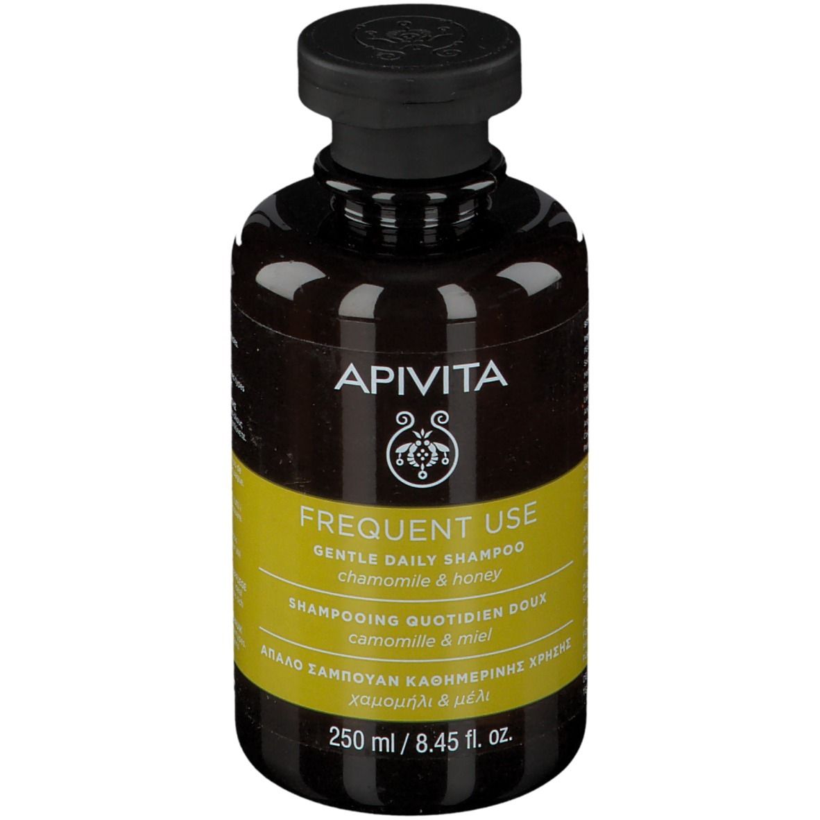 Flacone di shampoo marrone con tappo nero. Etichetta gialla con testo. Marchio: APIVITA.