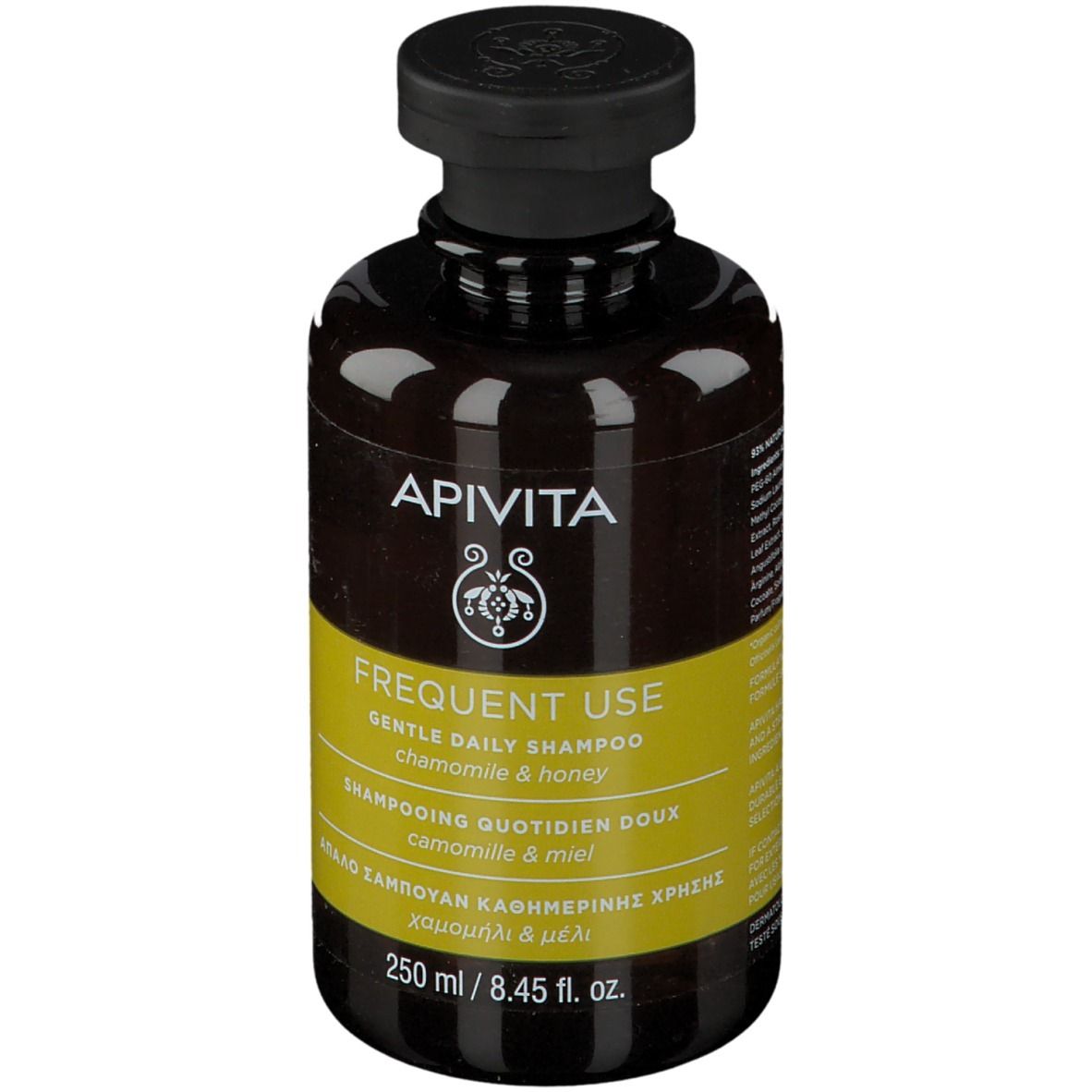 Flacone di shampoo marrone con tappo nero. Etichetta gialla con testo. Marchio: APIVITA.