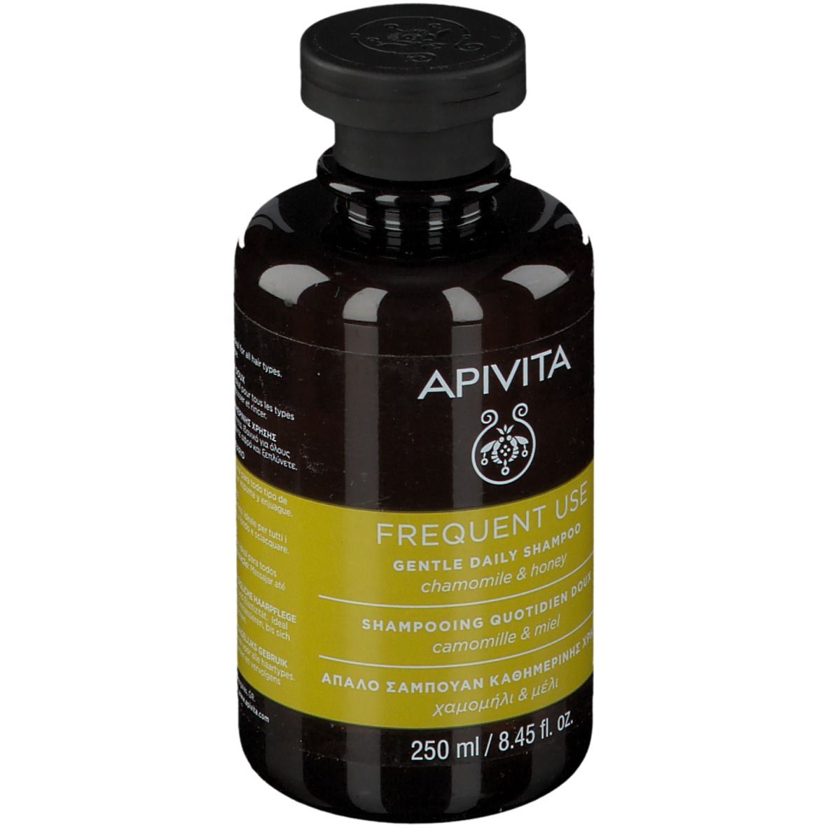 Flacone di shampoo marrone con tappo nero. Etichetta gialla con testo. Marchio: APIVITA.