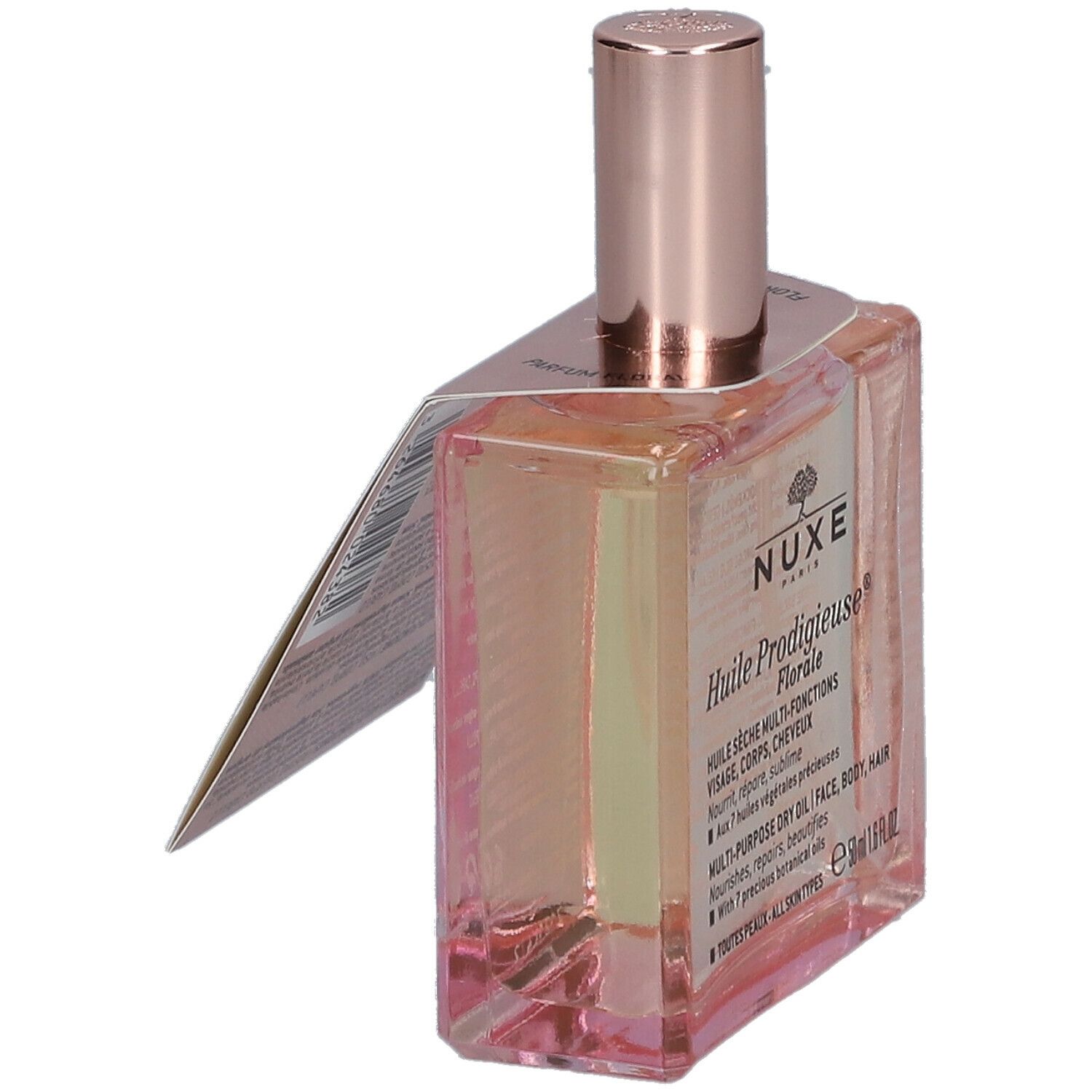 Flacone in vetro con olio rosato ed etichetta. Scritta: Nuxe Huile Prodigieuse Florale. Tappo rosa.