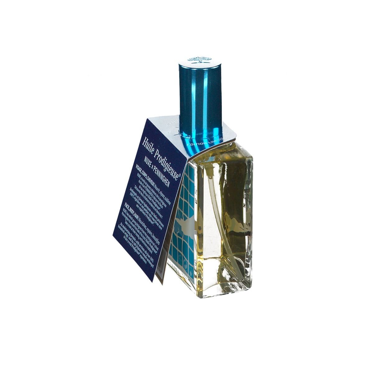 Flacone in vetro con tappo blu ed etichetta. Scritta: Huile Prodigieuse. Etichetta con informazioni sul prodotto.