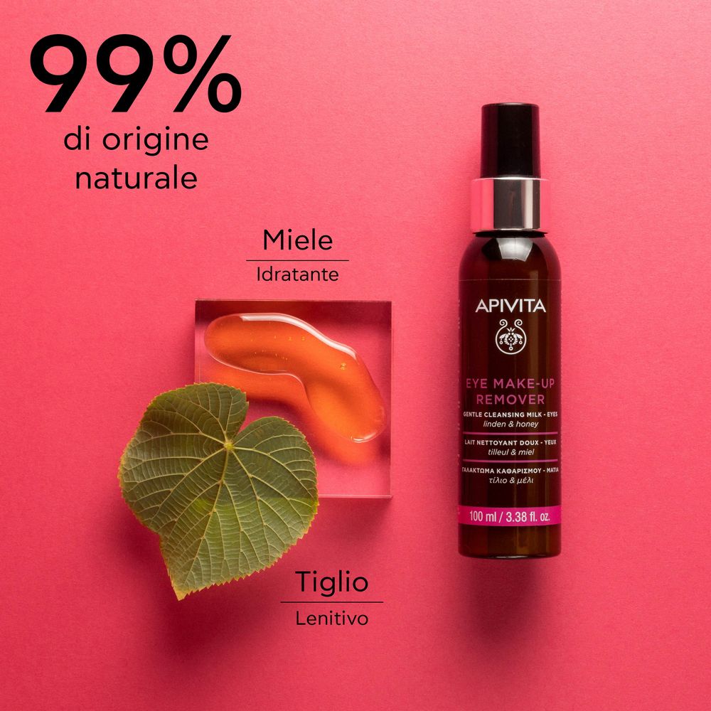APIVITA Eye Make-up Remover. Testo: 99% di origine naturale. Miele, tiglio. Su sfondo rosa.