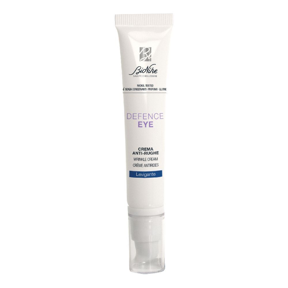 Weiße Tube mit Augencreme. Aufschrift: Defence Eye, Anti-Falten-Creme. Mit Applikator.