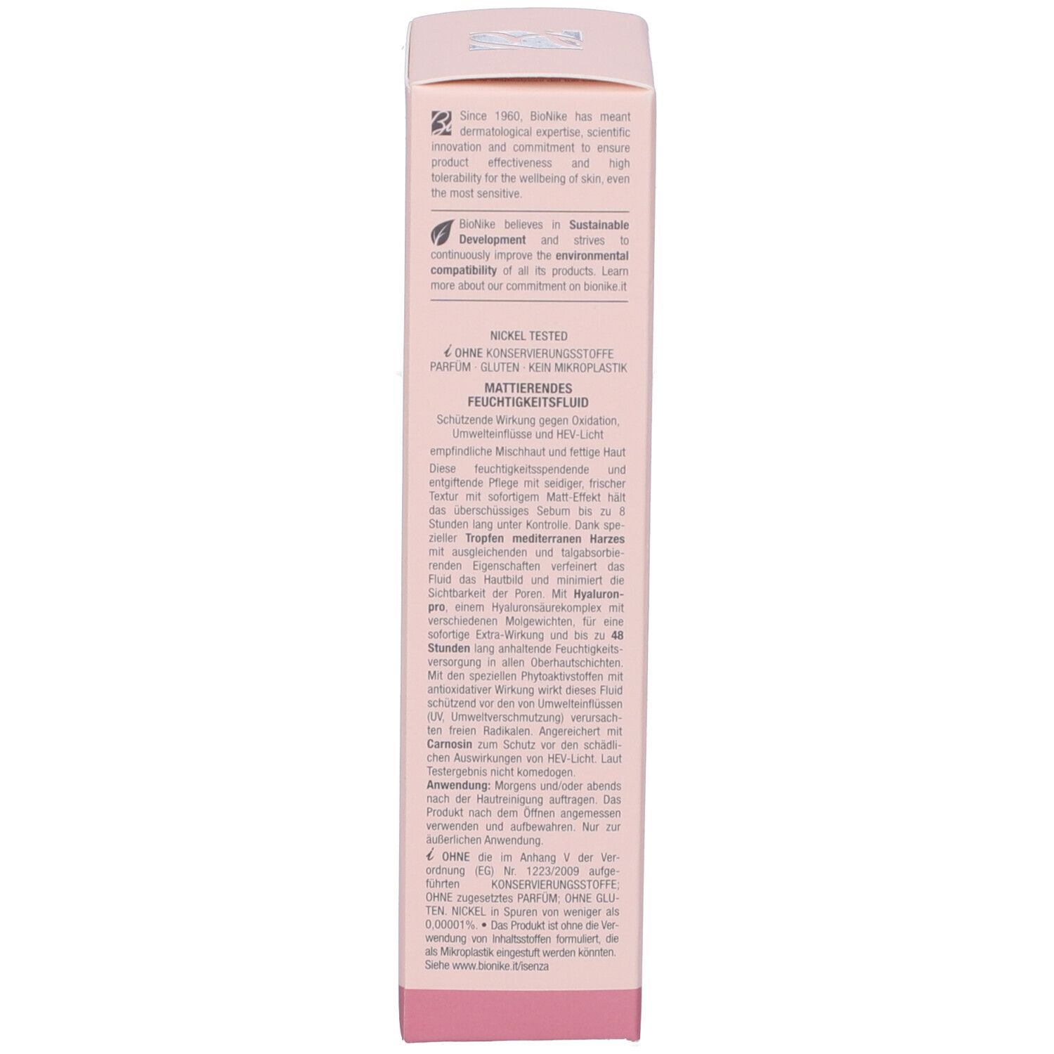 Seite der rosa Schachtel. Text in mehreren Sprachen. Enthält Informationen über das Marke und Inhaltsstoffe.