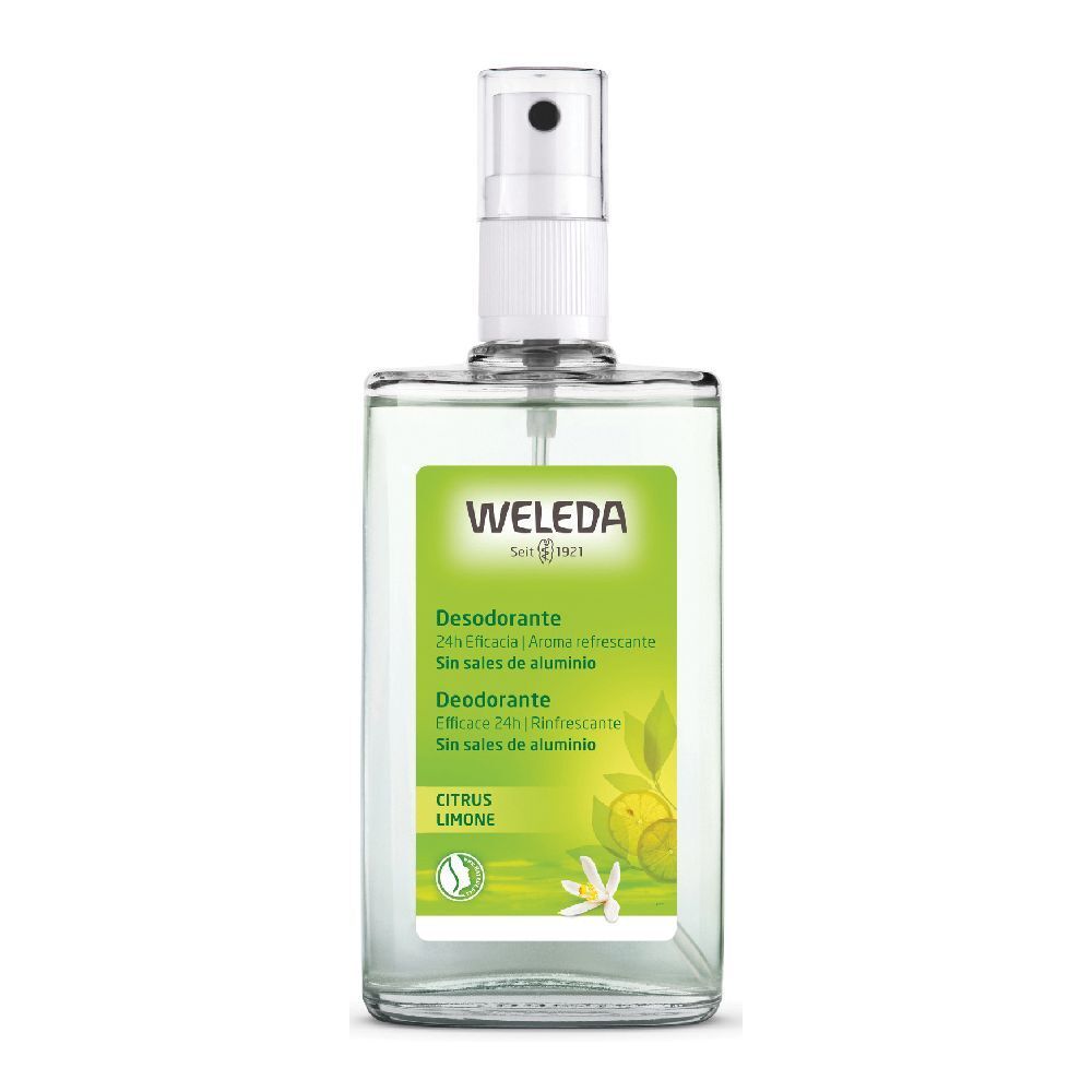 Flacone di vetro trasparente con vaporizzatore bianco. Etichetta verde e bianca con informazioni e logo.