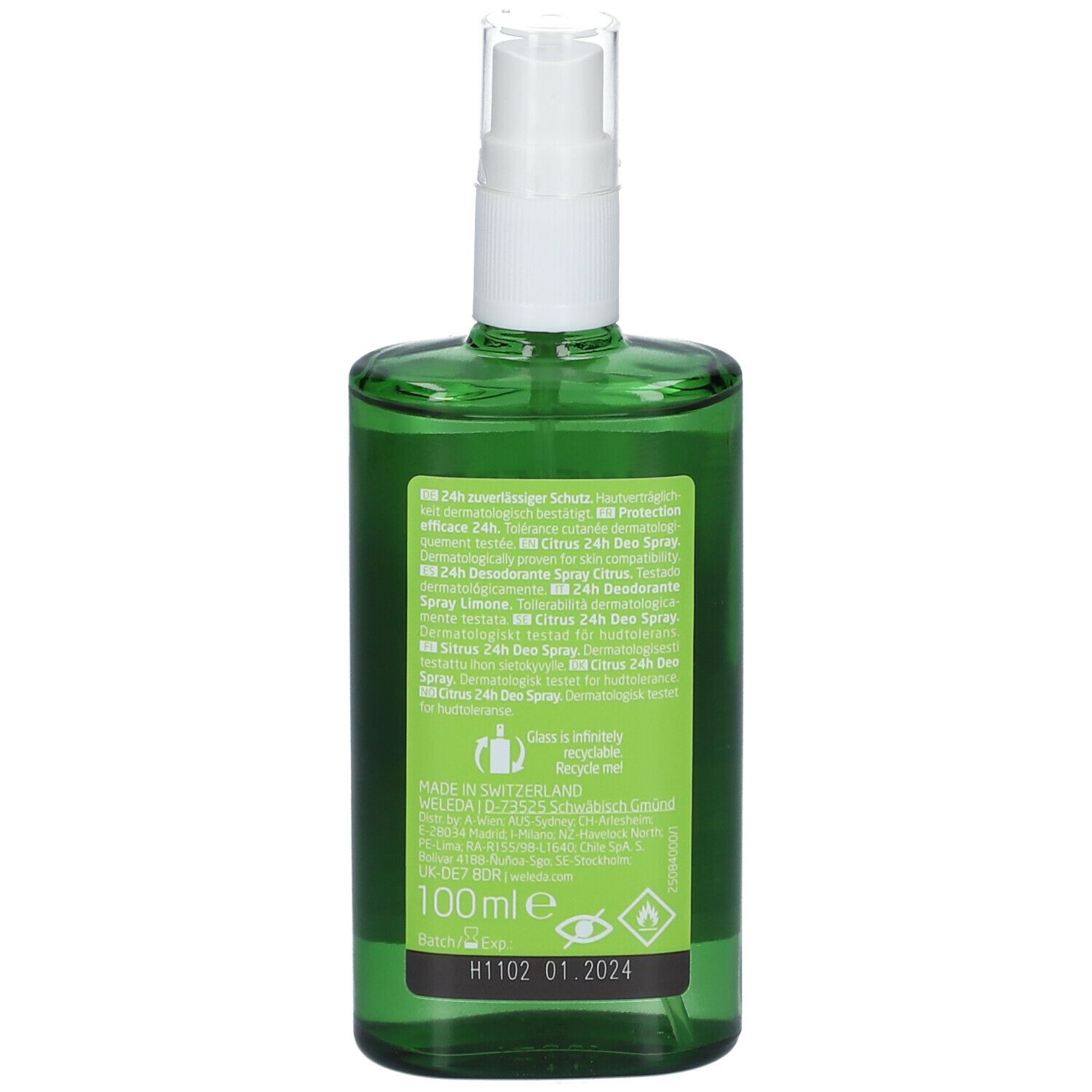 Retro del flacone di vetro verde con vaporizzatore bianco. Etichetta con informazioni e ingredienti.