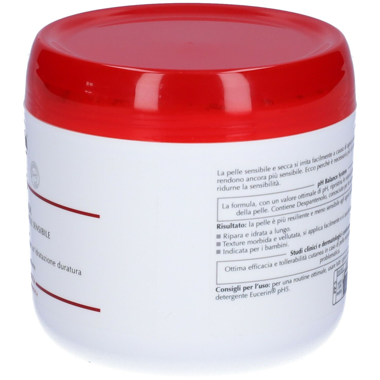 Retro di un vaso bianco con coperchio rosso. Testo in italiano.