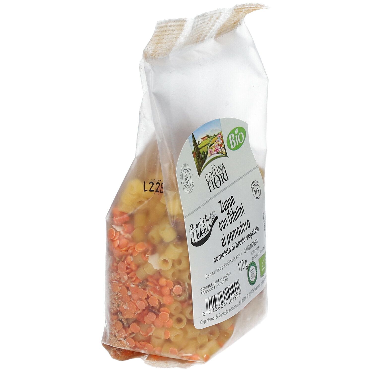 Confezione trasparente inclinata di zuppa di pomodoro senza glutine con ditalini. Marchio bio visibile.