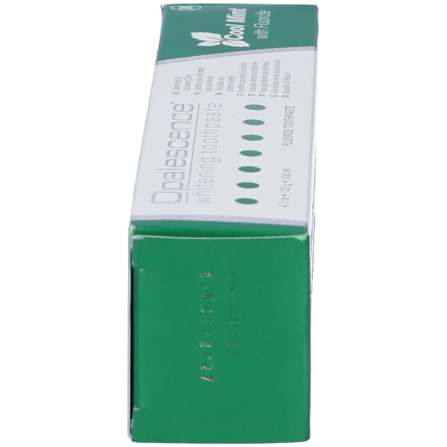 Scatola di dentifricio, lato verde. Scritta: Opalescence whitening toothpaste. Punti verdi.