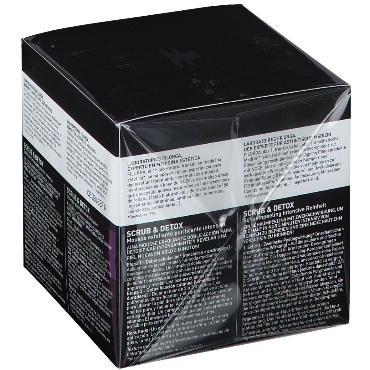 Boîte noire avec informations sur le produit. Inscription FILORGA SCRUB & DETOX. Texte: Exfoliant mousse pureté intense, Intense purity foam exfoliator.