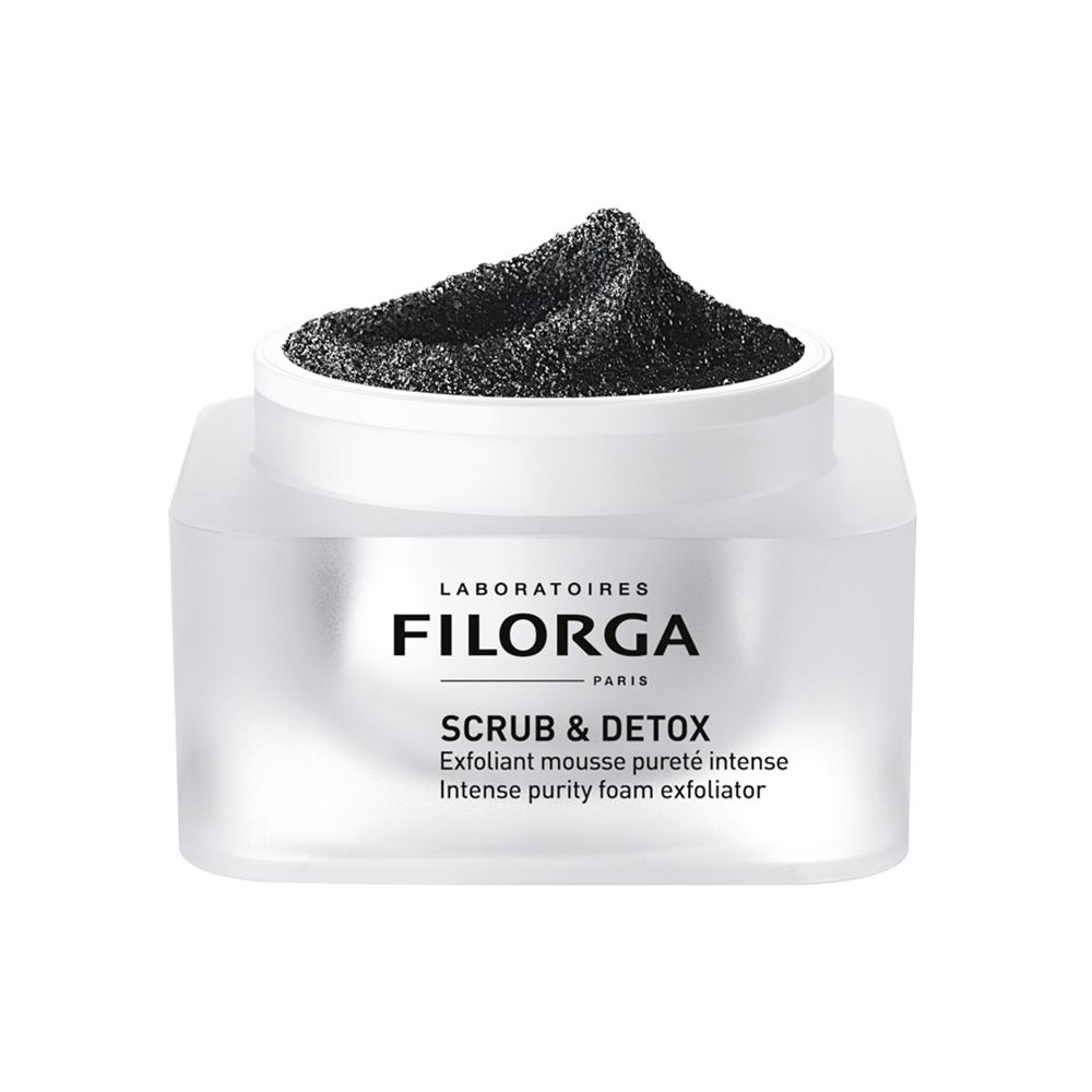 Pot blanc avec contenu noir. Inscription FILORGA SCRUB & DETOX. Texte: Exfoliant mousse pureté intense, Intense purity foam exfoliator.