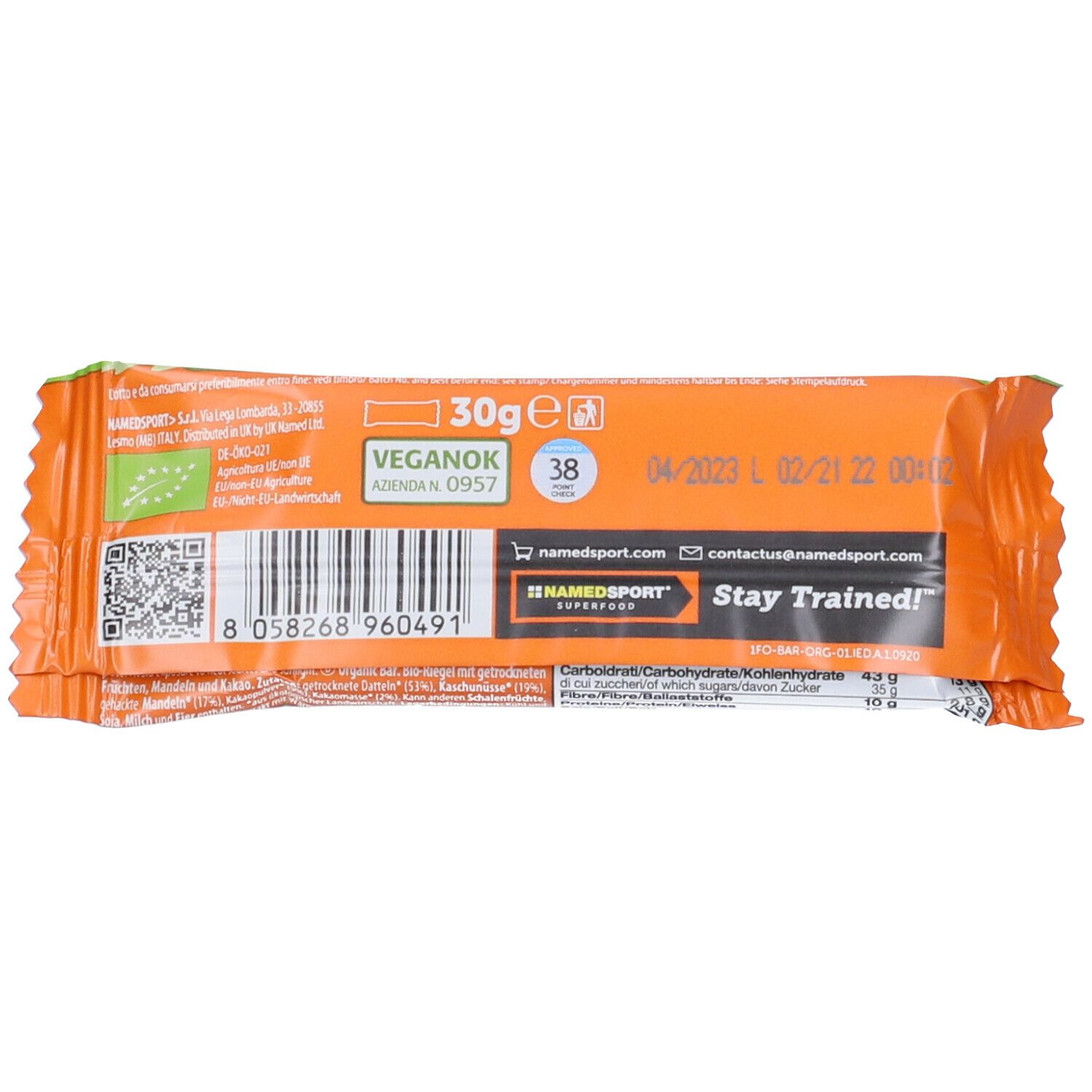 Retro della confezione della barretta NAMEDSPORT® OrganicBar. Sfondo arancione. Scritta: 30g, Vegan OK, data di scadenza, codice a barre.
