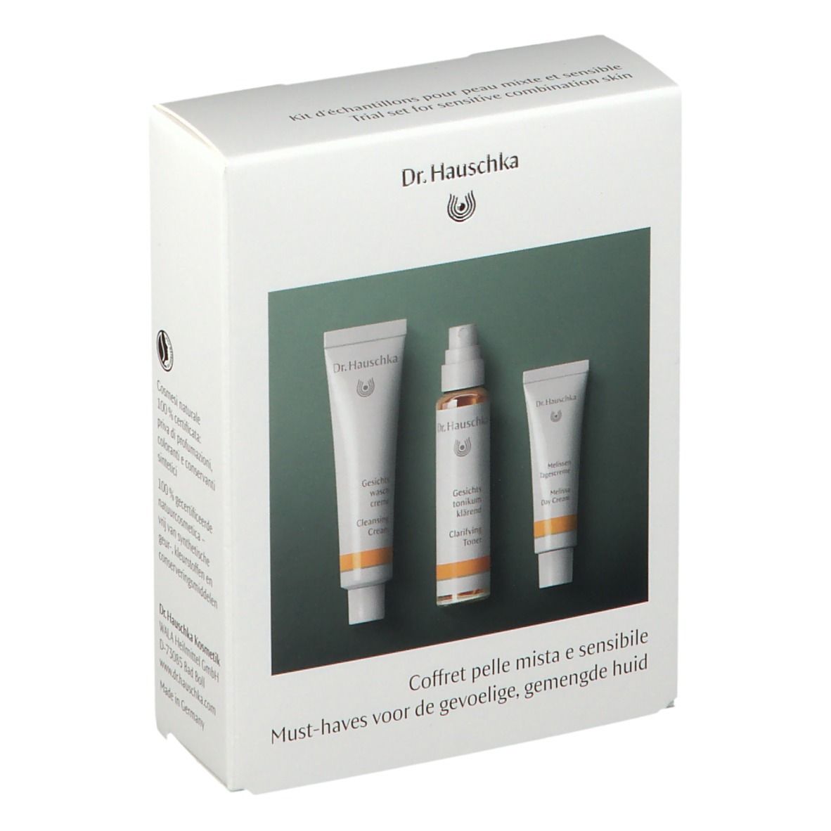 Scatola bianca con tre prodotti. Scritto: Dr. Hauschka. Testo multilingue.