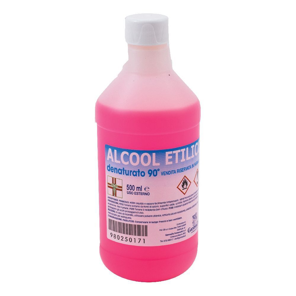 Bottiglia con liquido rosa. Scritta: Alcool Etilico Denaturato 90°. 500 ml. Tappo bianco.