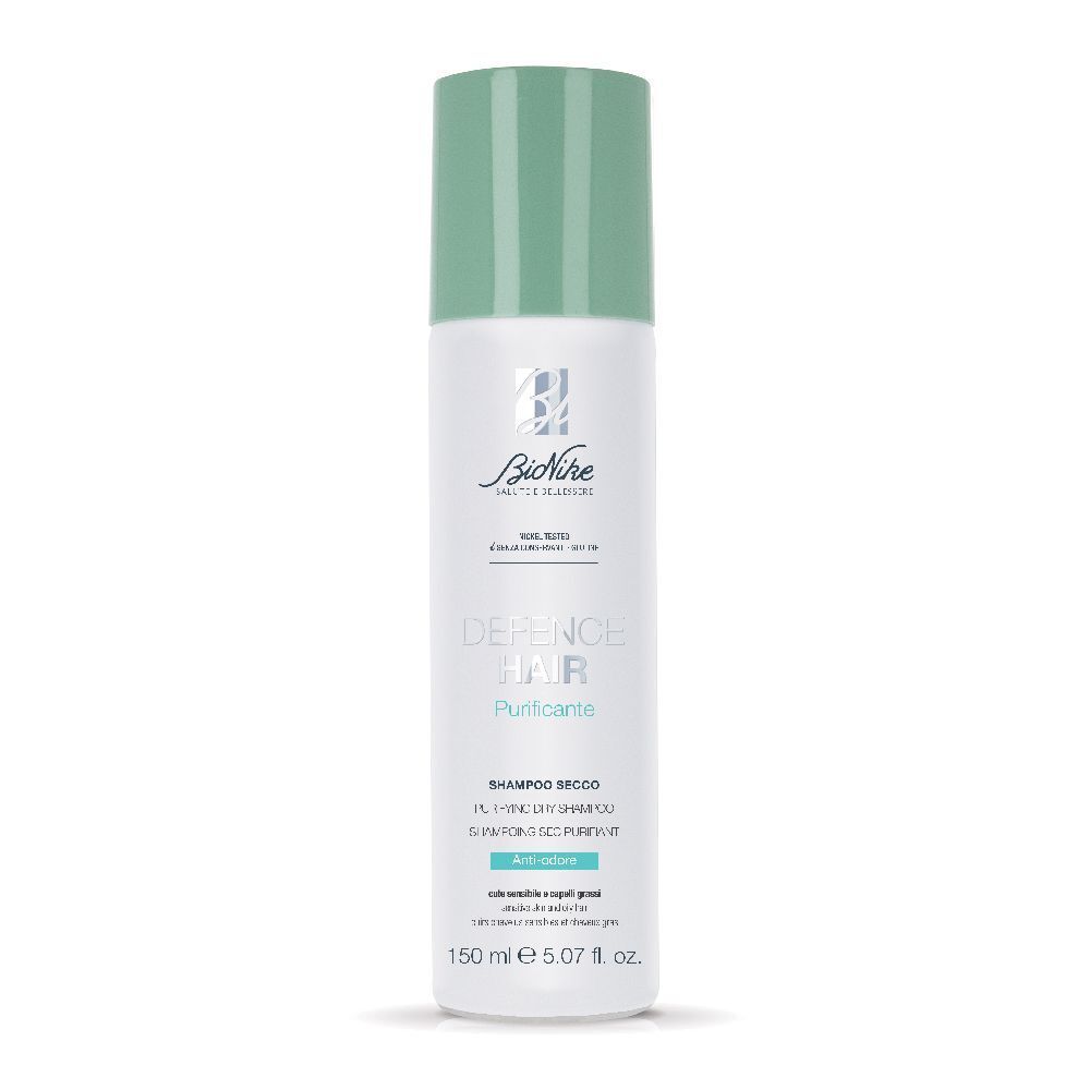 Bionike Defence Hair Shampoo Secco Purificante. Flacone bianco con tappo verde. Nome del prodotto e logo visibili.