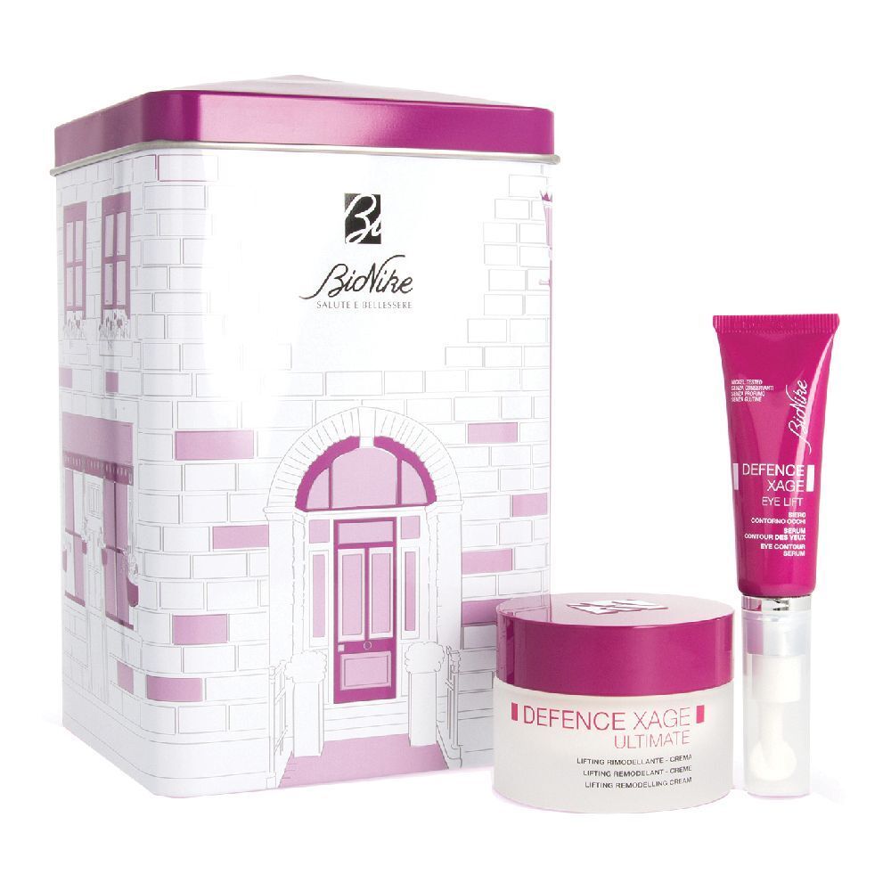 Set regalo con scatola a forma di casa, crema, crema occhi e siero. Confezione rosa e bianca. Testo: Bionike, Defence Xage.