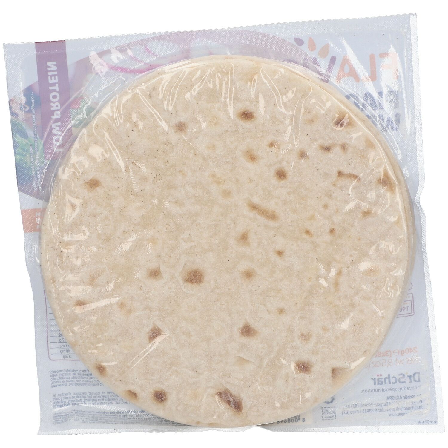 Piadina FLAVIS rotonda confezionata. Confezione in plastica trasparente. Scritte parzialmente visibili.