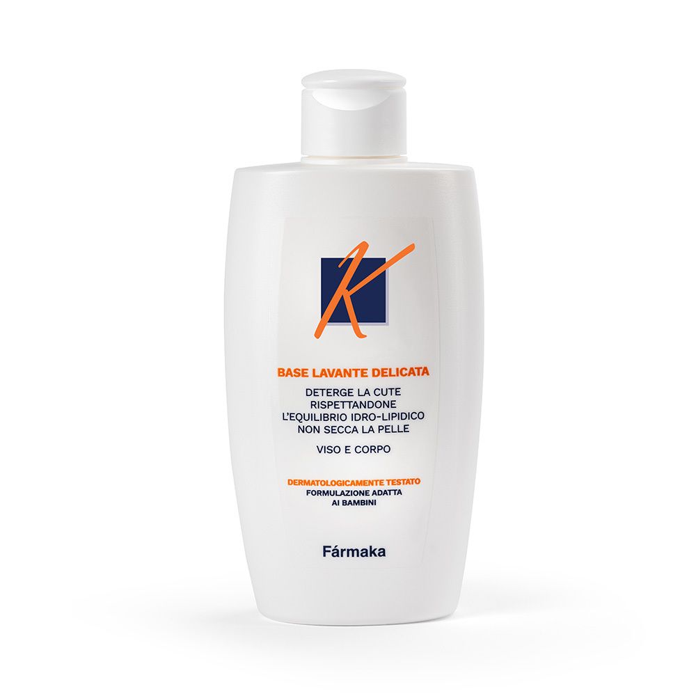 Flacone bianco con tappo a ribalta. Scritta: Kouriles Base Lavante. Per viso e corpo. Dermatologicamente testato.