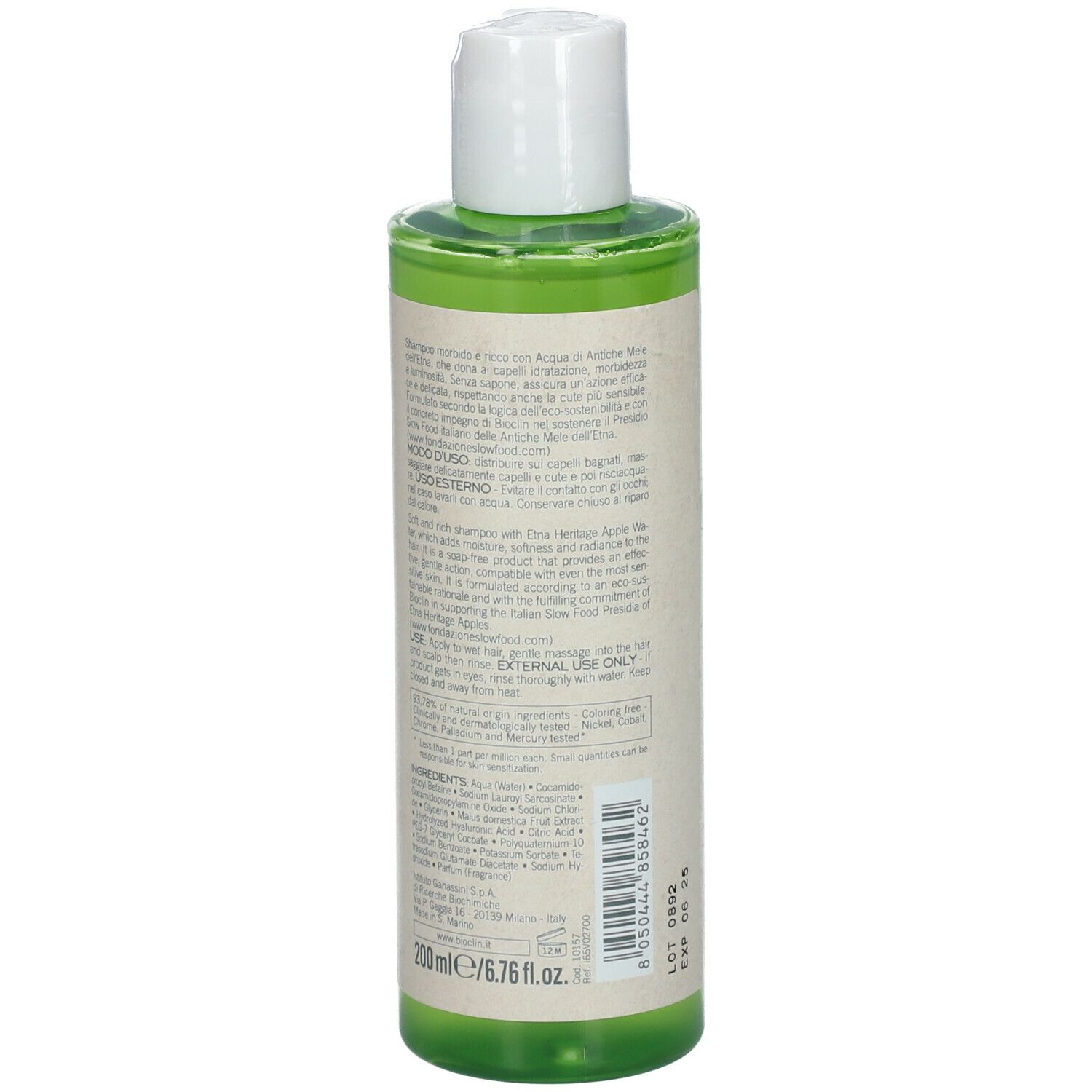 Retro di un flacone di shampoo verde con tappo bianco. Testo: BIO-HYDRA Shampoo, ingredienti, istruzioni per l'uso. Numero di lotto e data di scadenza.