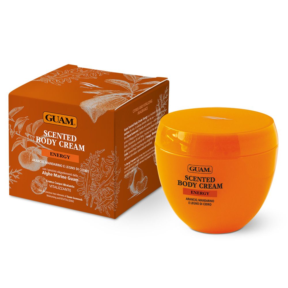 Vaso e confezione di crema arancione. Scritta: GUAM Scented Body Cream Energy. Con mandarino e legno di cedro.