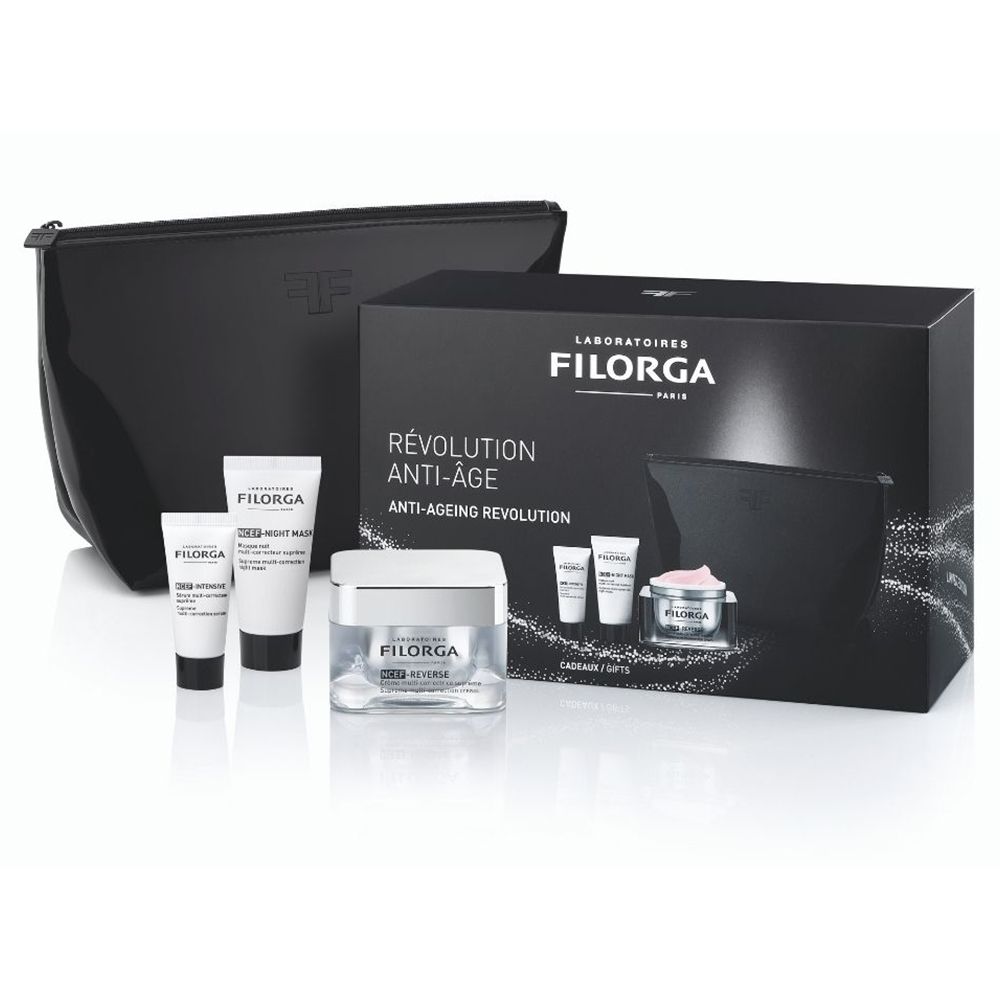 Coffret cadeau cosmétique FILORGA. Contient crèmes, tubes et trousse noire. Inscription «RÉVOLUTION ANTI-ÂGE».