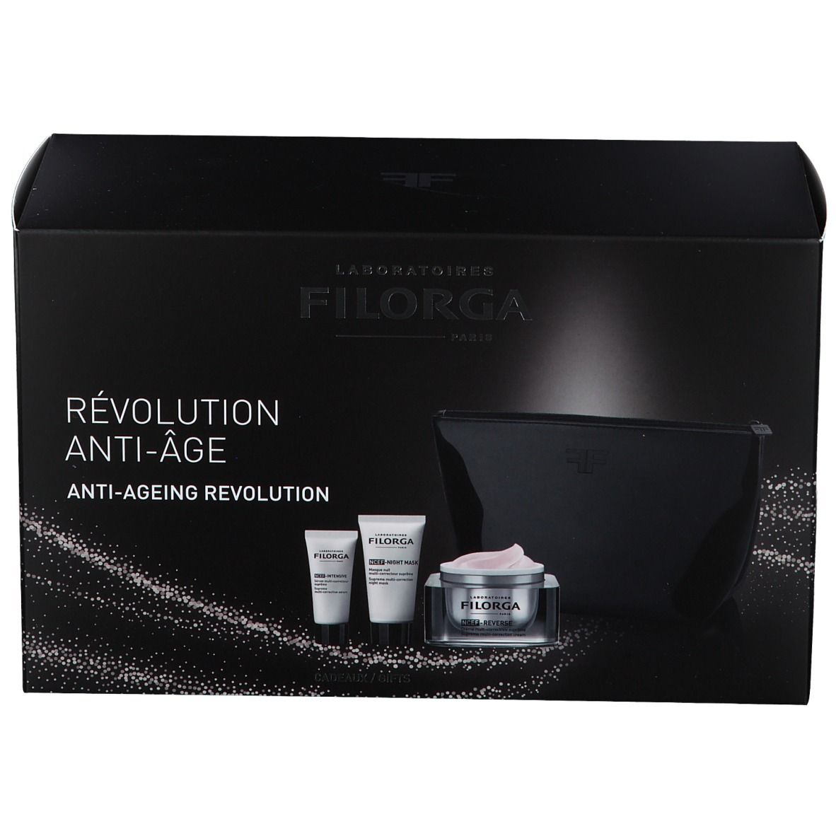 Coffret cadeau noir avec cosmétiques. Contient crèmes, tubes et trousse. Marque FILORGA. Inscription «RÉVOLUTION ANTI-ÂGE».