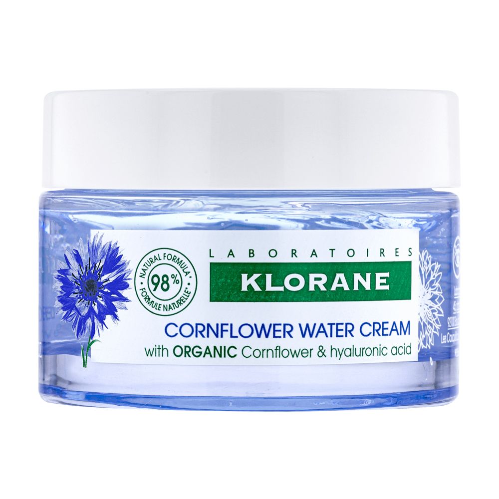 Blaue Creme in einem Glas mit weißem Deckel. Aufschrift: Klorane, Kornblumenwasser-Creme.